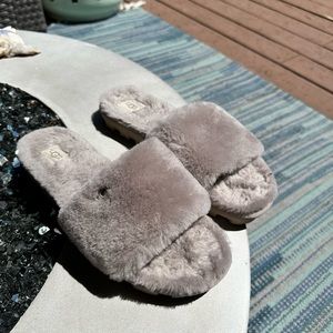 Comfy UGG Cozetta slide slippers.